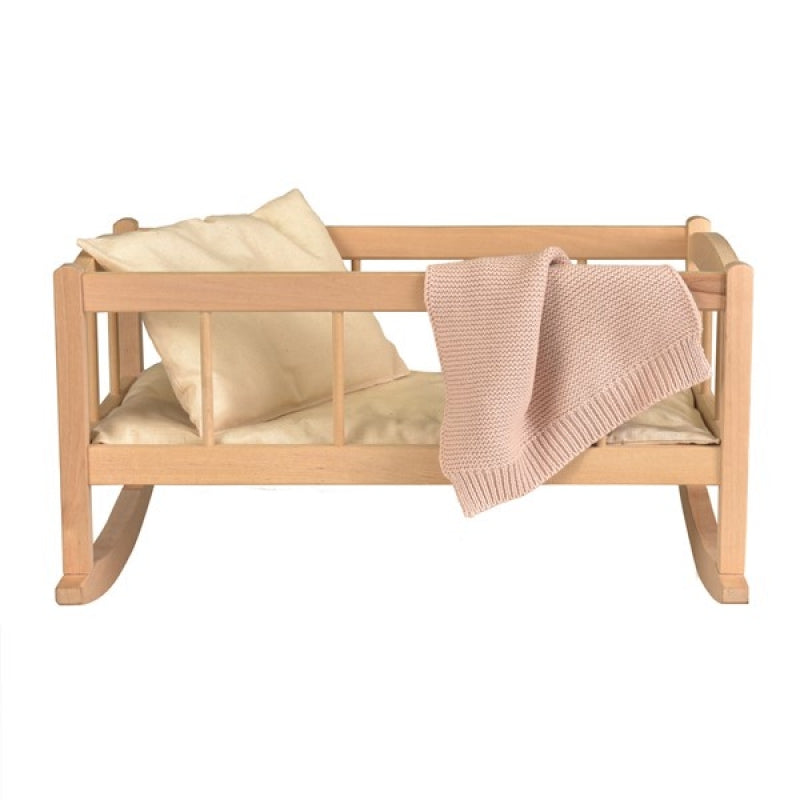 wooden rocking cradle with knitted blanket